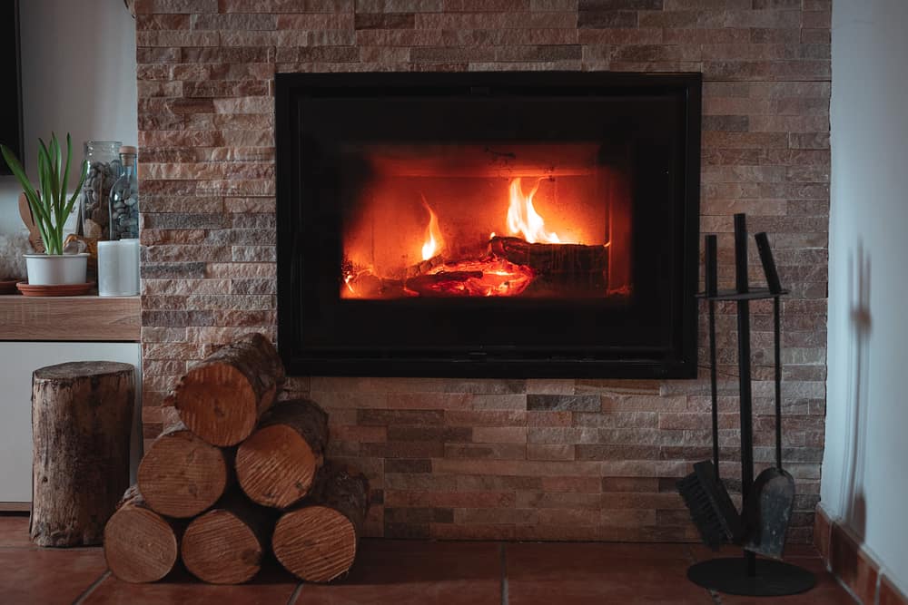 Fire Place With Small Logs Near It