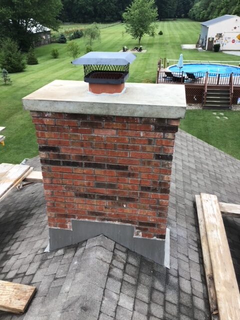 New chimney crown on a red brick chimney