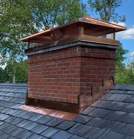 Copper outside mount cap on a back chimney