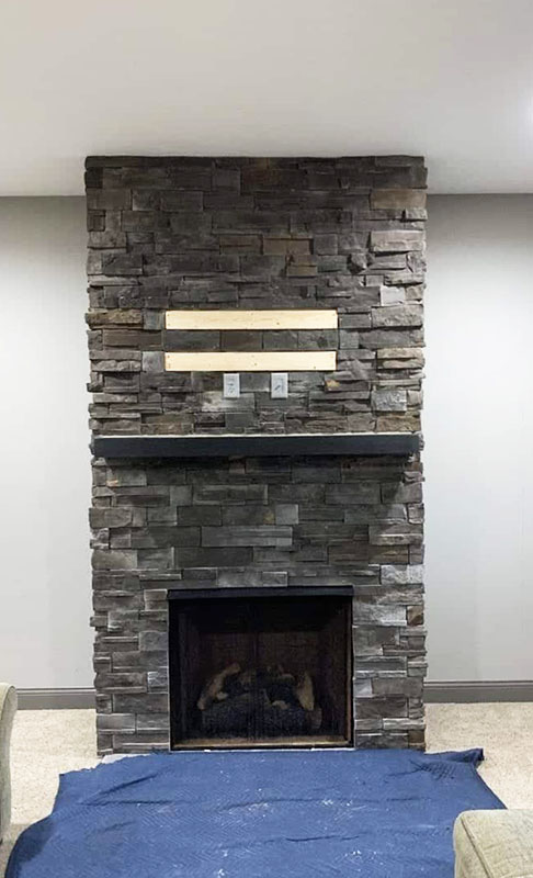 Dark grey stone fireplace