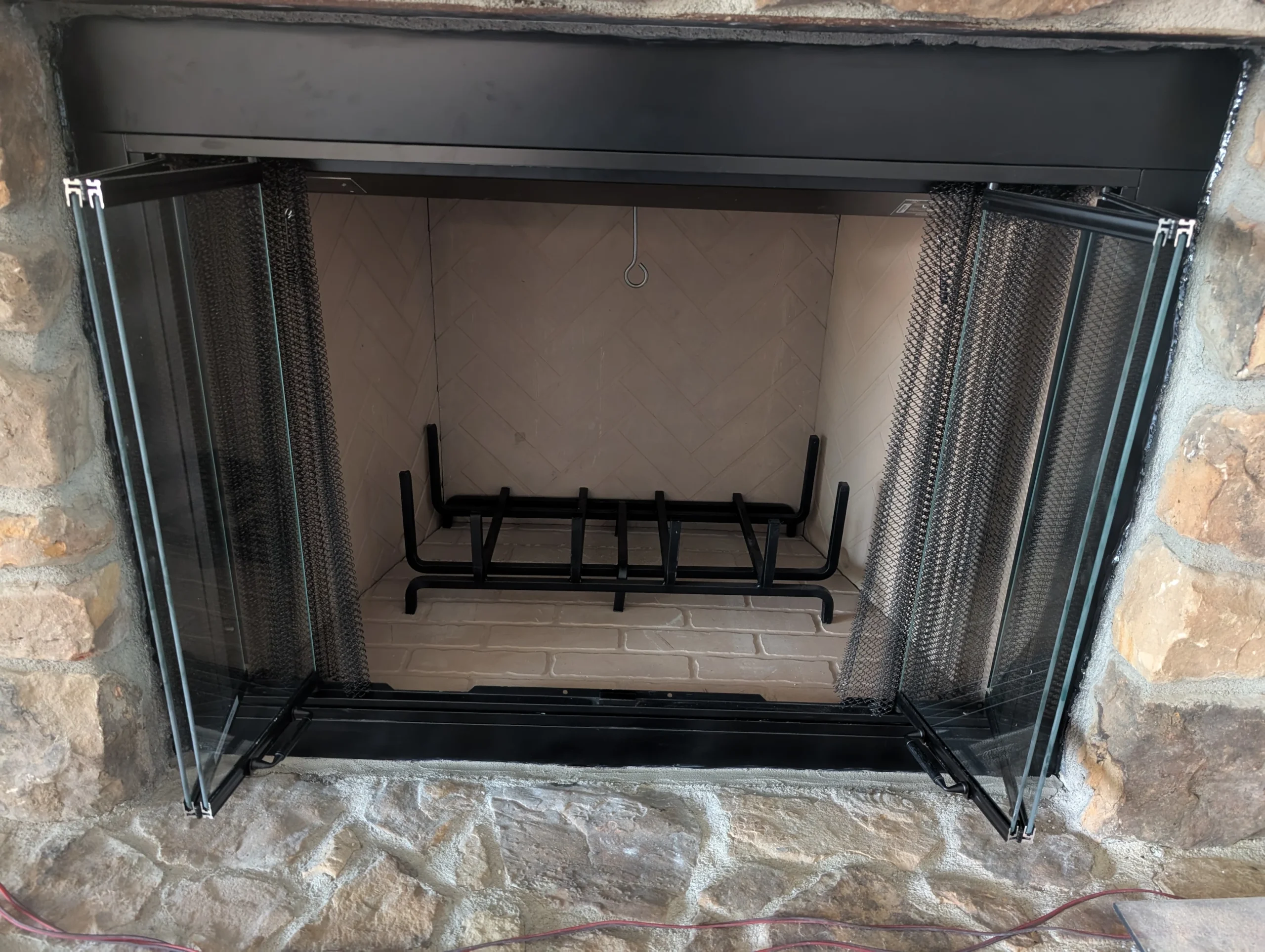 The Smalling Masonry work truck wrapped with a brick design and the Smalling Masonry logo. There is a tudor house in the background.